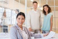 Casual business team having a meeting smiling at camera Royalty Free Stock Photo