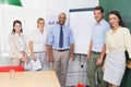 Casual business team having a meeting smiling at camera Royalty Free Stock Photo