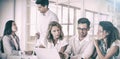 Casual business team having a meeting using laptop Royalty Free Stock Photo