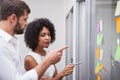 Casual business team looking at sticky notes Royalty Free Stock Photo