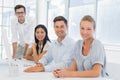 Casual business team smiling at camera during meeting Royalty Free Stock Photo