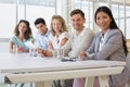 Casual business team smiling at camera during meeting Royalty Free Stock Photo