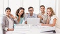 Casual business team smiling at camera during meeting Royalty Free Stock Photo