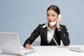 Casual business woman in office talking by phone Royalty Free Stock Photo