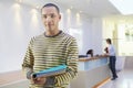 Casual Businessman With Colleagues At Office Reception Behind Royalty Free Stock Photo