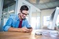 Casual businessman texting with his mobile phone Royalty Free Stock Photo