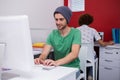 Casual businessman using computer in office Royalty Free Stock Photo