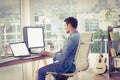 Casual businessman using computer in office Royalty Free Stock Photo