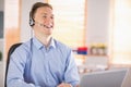 Casual businessman using headset on a call Royalty Free Stock Photo