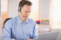 Casual businessman using headset on a call Royalty Free Stock Photo