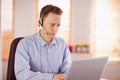 Casual businessman using headset on a call