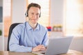 Casual businessman using headset on a call