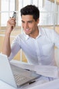 Casual businessman using his laptop at his desk Royalty Free Stock Photo