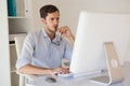 Casual businessman working at his desk Royalty Free Stock Photo