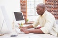 Casual businessman working at his desk Royalty Free Stock Photo