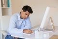 Casual businessman writing at his desk Royalty Free Stock Photo