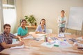 Casual businesswoman giving presentation to her colleagues Royalty Free Stock Photo