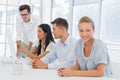 Casual businesswoman smiling at camera during meeting Royalty Free Stock Photo