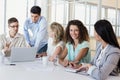 Casual businesswoman smiling at camera during meeting Royalty Free Stock Photo