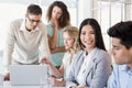 Casual businesswoman smiling at camera during meeting Royalty Free Stock Photo