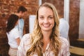 Casual businesswoman smiling at camera during meeting Royalty Free Stock Photo