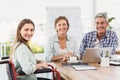 Casual businesswoman in wheelchair with colleagues Royalty Free Stock Photo