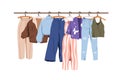 Casual clothes on hanger rail, rack. Modern women wardrobe, spring and summer wearing row. Trendy female apparel