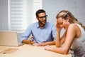 Casual colleagues in an argument at desk Royalty Free Stock Photo