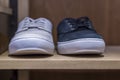 Casual comfortable men`s shoes on the shelves in the store. Style and fashion. Close-up. Selective focus. Front view Royalty Free Stock Photo