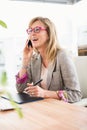 Casual designer having a phone call Royalty Free Stock Photo