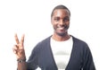 Casual dressed afro-american man with blue sweater and showing victory sign.