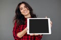 Casual happy Woman Showing Digital Tablet With Blank Screen Royalty Free Stock Photo