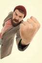 Casual and informal. Bearded man in casual style shaking his fist with anger. Fashion male model wearing casual jacket