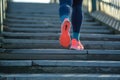 casual jogger taking evenly paced steps on riverside stairs Royalty Free Stock Photo