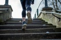 casual jogger taking evenly paced steps on riverside stairs Royalty Free Stock Photo