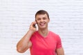 Casual Man Cell Phone Call Speak Smartphone Standing Over Wall Royalty Free Stock Photo