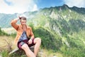 Casual man fixes hair in the nature Royalty Free Stock Photo