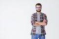 Casual man in glasses standing with arms folded Royalty Free Stock Photo