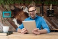 Casual man holding tablet with both hands happy Royalty Free Stock Photo