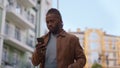 Casual man making phone call walk city street portrait. Urban lifestyle concept