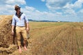 Casual man next to haystack looks away Royalty Free Stock Photo