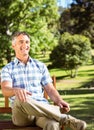 Casual man relaxing on park bench Royalty Free Stock Photo