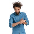 Casual man rubbing his palms and making a diabolical plan Royalty Free Stock Photo