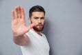 Casual man showing stop sign o Royalty Free Stock Photo