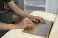 Casual man sitting in living room and working online with computer laptop. Royalty Free Stock Photo