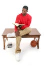 Casual Man Sitting on Table Reading Book Royalty Free Stock Photo