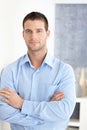 Casual man standing arms crossed smiling Royalty Free Stock Photo