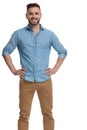 Casual man standing with hands on waist confident Royalty Free Stock Photo