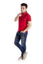 Casual man with t-shirt and jeans pointing at the camera Royalty Free Stock Photo