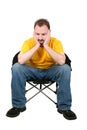 Casual Man Upset Sitting In Chair Over White Royalty Free Stock Photo